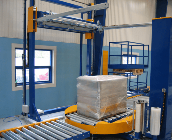 Inline pallet stretch wrapping machine for pallet wrapping and top film sheet dispenser